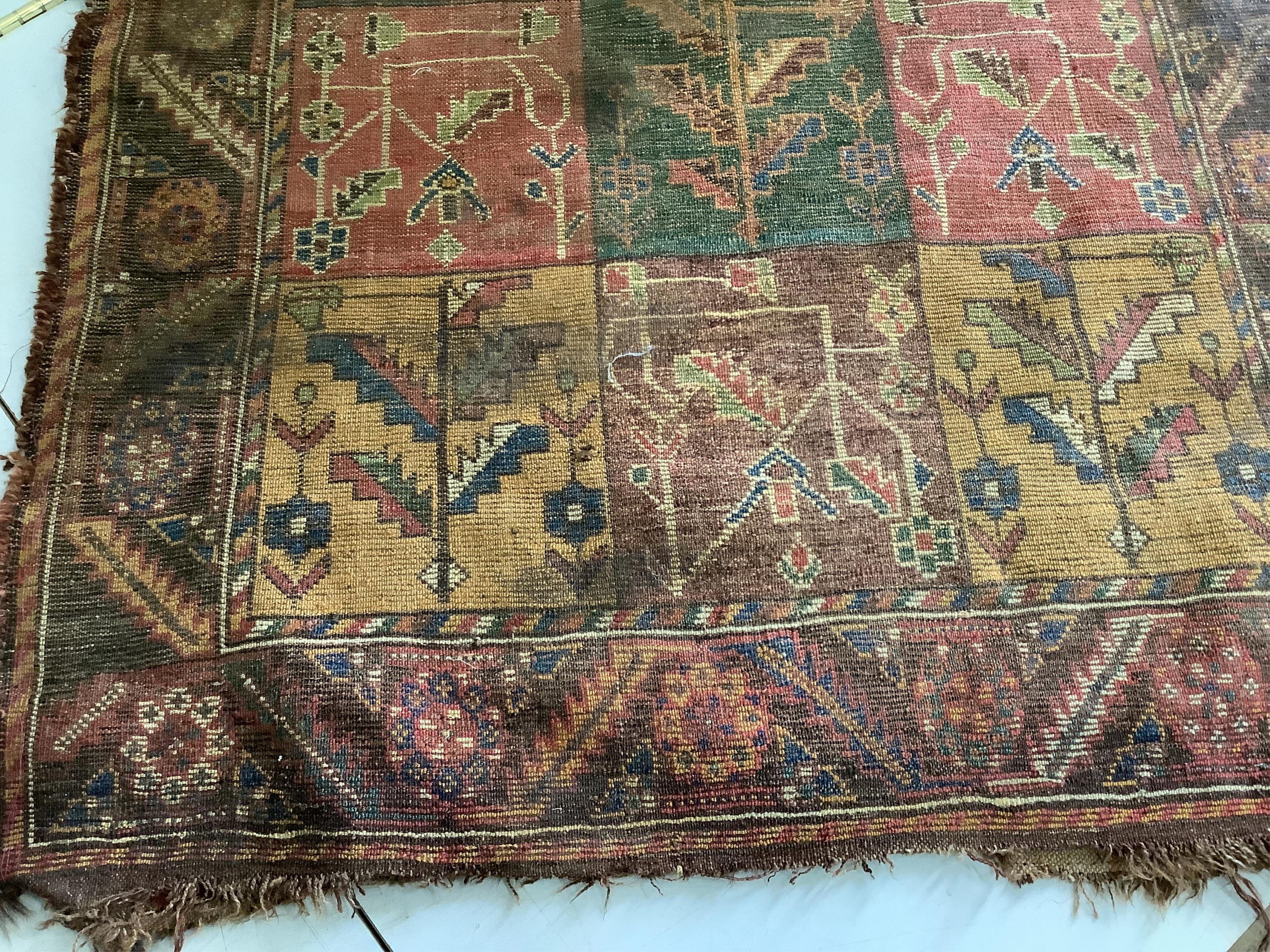 An antique Baktiari rug, 180 x 108cm. Condition - fair